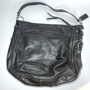 Black Coach shoulder bag purse with short and long straps.